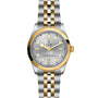 The TUDOR Black Bay One 36 S&G is a two-tone wristwatch with a silver dial, gold bezel, gold and silver bracelet, date window, and is chronometer officially certified.