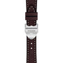 Close-up of a brown leather strap with white stitching and a silver TUDOR-engraved buckle, highlighting the classic craftsmanship found in TUDORs 1926 watches.