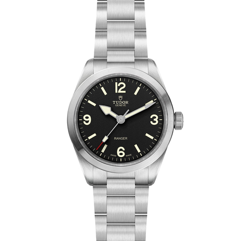 The TUDOR Ranger is a stainless steel watch with a black dial, Super Luminova hands, Arabic numerals at 12, 3, 6, and 9, powered by the Tudor MT5402 movement and presented on a metal bracelet.