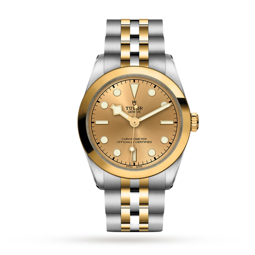 A TUDOR Black Bay One 31 S&G wristwatch with a gold dial and two-tone gold and silver metal link bracelet, shown on a white background.