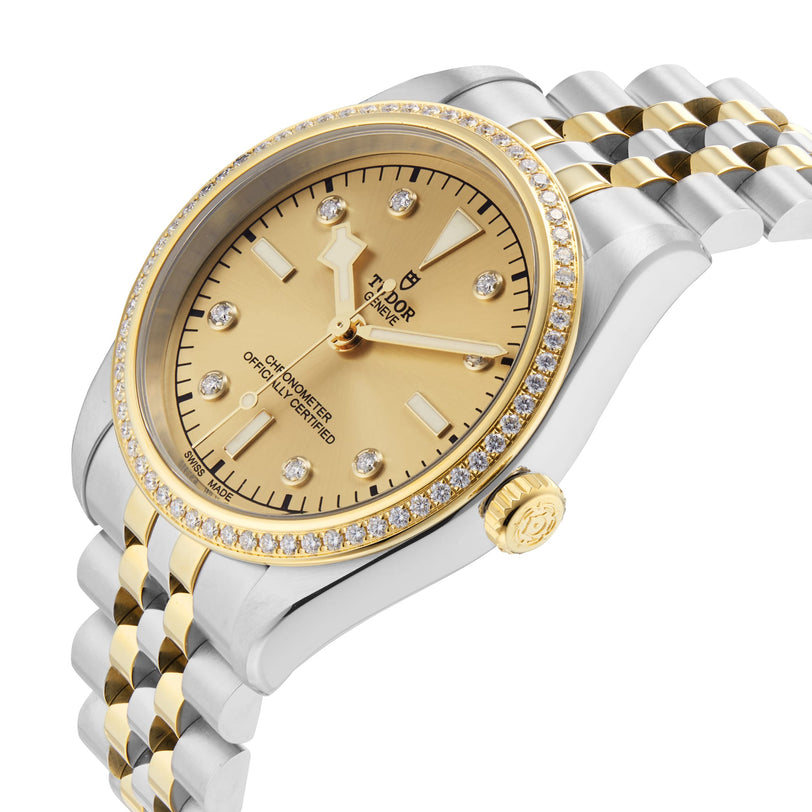 The TUDOR Black Bay One 36 S&G is a luxury two-tone wristwatch featuring a yellow gold and silver bracelet, gold dial, diamond hour markers, and diamond-set bezel with classic Black Bay-inspired design.