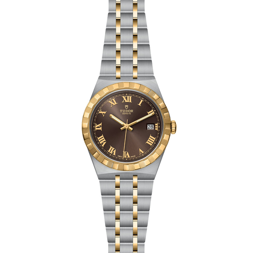 The TUDOR Royal is a sport-chic two-tone wristwatch with a gold and silver bracelet, brown dial, Roman numerals, gold bezel, automatic movement, and a date window at 3 o’clock.