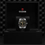 The TUDOR Black Bay 54 dive watch with black dial and bezel is shown in an open black Tudor box, featuring the logo on the inside lid. It runs on the Manufacture Calibre MT5400 movement.