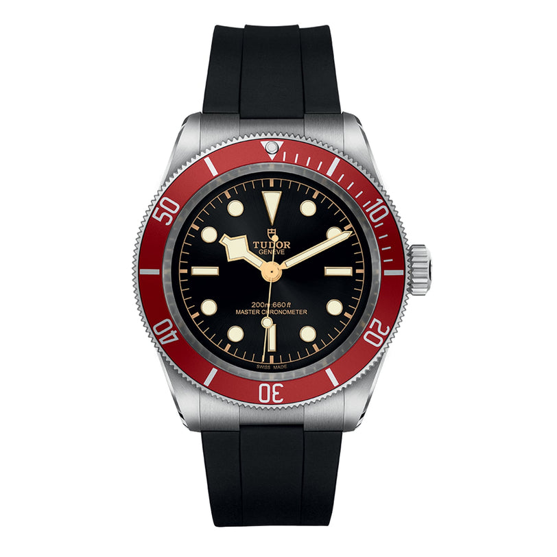 A TUDOR Black Bay watch with a black dial, luminous markers, burgundy bezel, and black rubber strap is displayed on a white background.