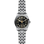 The TUDOR Black Bay One 36 is a stainless steel unisex wristwatch featuring a black dial, vintage hour markers, and a metal bracelet—a chic expression of technical refinement.