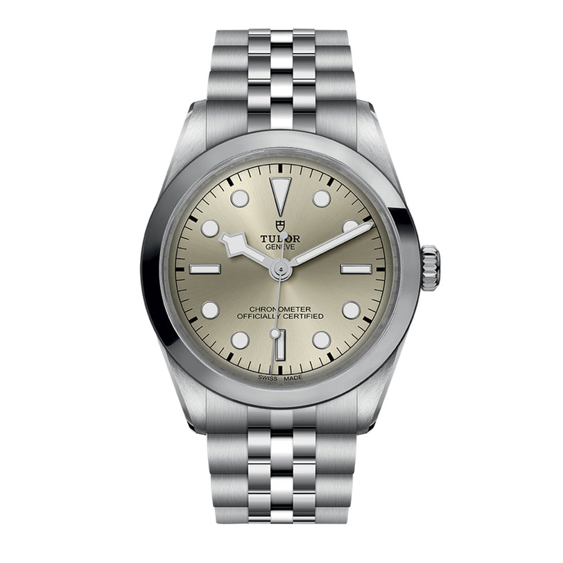 The TUDOR Black Bay One 36 is a stainless steel unisex watch with a silver dial, black hour markers, and a jubilee-style bracelet, photographed elegantly from the front to showcase its Black Bay-inspired sophistication.