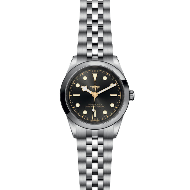 The TUDOR Black Bay One 41 features a black dial, round hour markers, luminous hands, and a stainless steel jubilee-style bracelet—delivering unisex chic style and precise timekeeping with Manufacture Calibres.