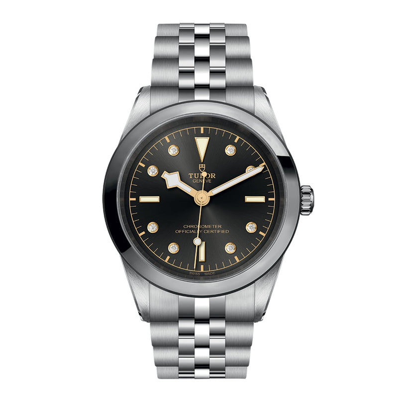 The TUDOR Black Bay One 41 is a unisex wristwatch crafted from 316L steel, showcasing a black dial with silver hour markers and a sleek silver metal bracelet, elegantly displayed from the front.