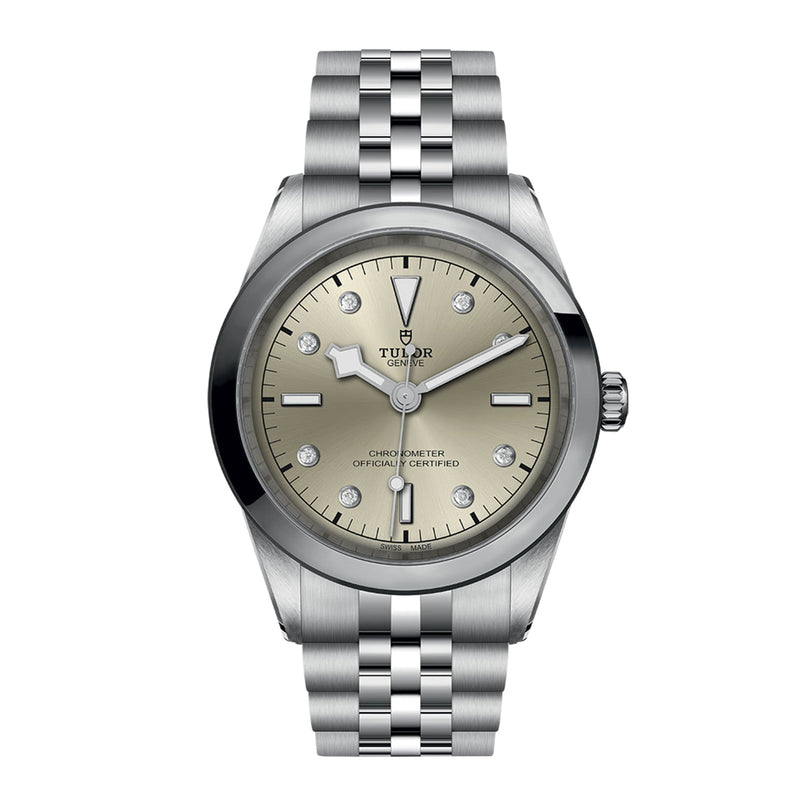 The TUDOR Black Bay One 41 is a unisex stainless steel watch featuring a silver dial, diamond hour markers, date display at 3 o’clock, and a metal link bracelet—showcasing the signature elegance of Black Bay models.