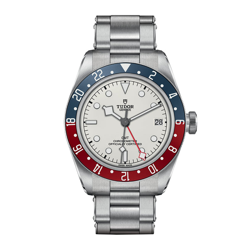 The TUDOR Black Bay GMT is a stainless steel watch featuring an opaline dial, red and blue bezel, GMT function, date at 3 o’clock, and a stainless steel bracelet.