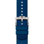 A blue fabric watch strap with a silver buckle and two blue loops, shown vertically—crafted for the TUDOR Pelagos FXD to match its robust titanium case.