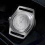 Close-up of the titanium case back on the TUDOR Pelagos FXD, engraved with Marine Nationale, an anchor emblem, M.N.25, and manufacturer details; water resistant to 200m.