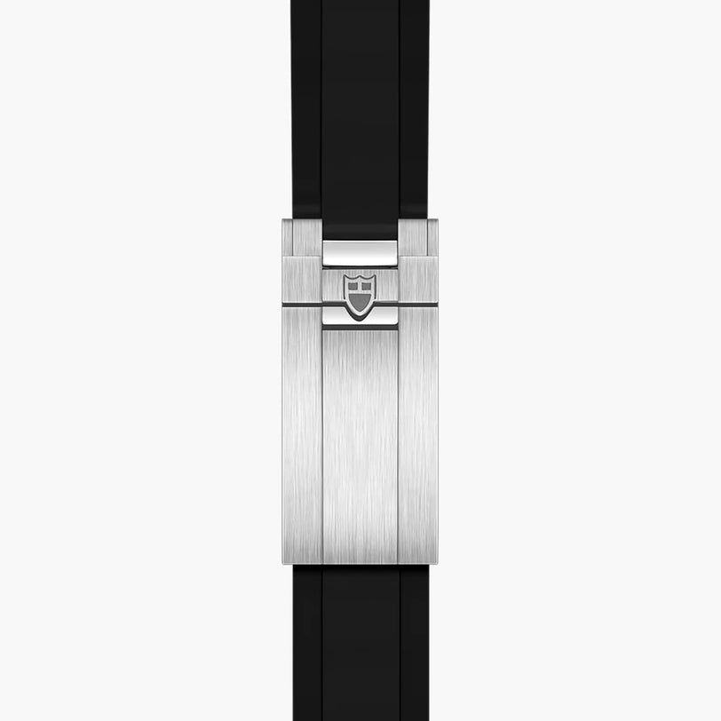The TUDOR Black Bay 58 features a silver clasp with a brushed metal finish and shield emblem on its black strap, displayed against a white background.