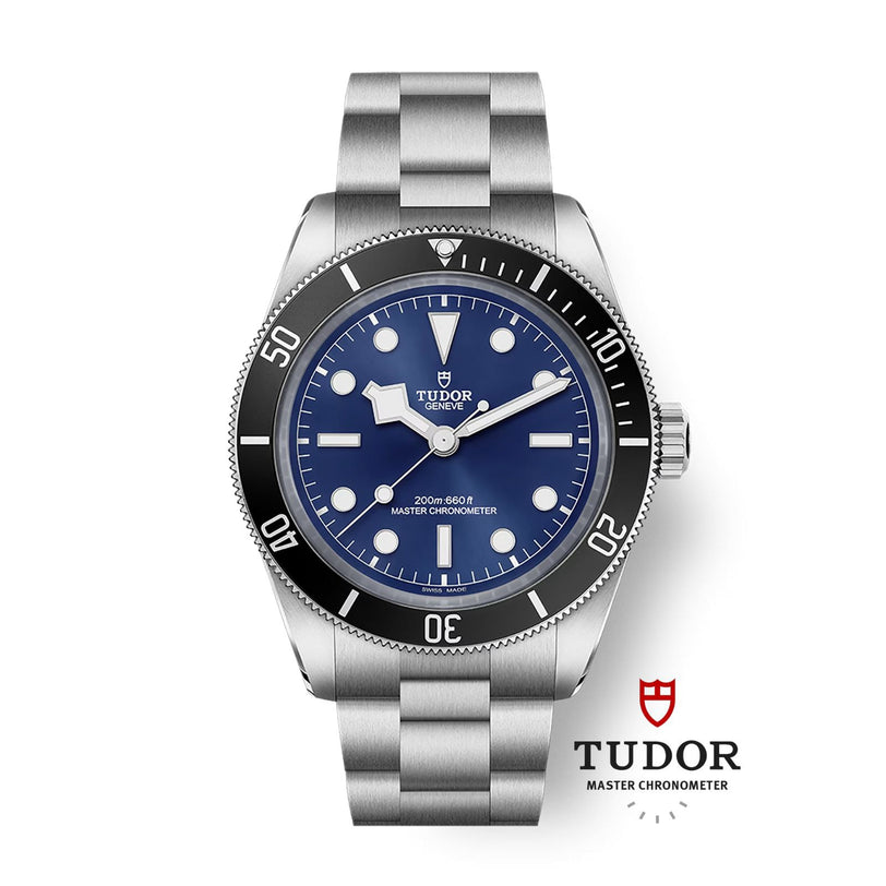 The TUDOR Black Bay 68 is a dive watch featuring a blue dial, steel bracelet, and black bezel with the TUDOR logo below.