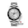 TUDOR Black Bay 68 wristwatch featuring a white dial, black bezel, and steel bracelet; TUDOR logo displayed below.