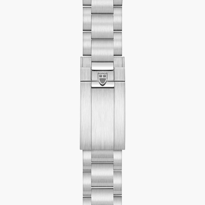 The TUDOR Black Bay 68 features a brushed stainless steel bracelet with a folding clasp adorned with the signature shield logo.