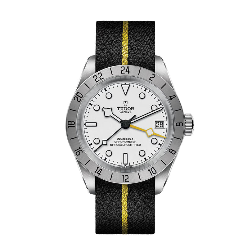 A TUDOR Black Bay Pro wristwatch featuring a silver case, white dial, black strap, and a yellow stripe down the center.