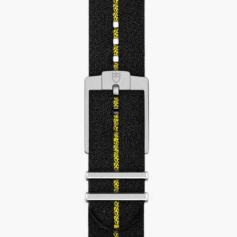 TUDOR Black Bay Pro black fabric watch strap with a yellow center stripe and a silver buckle.