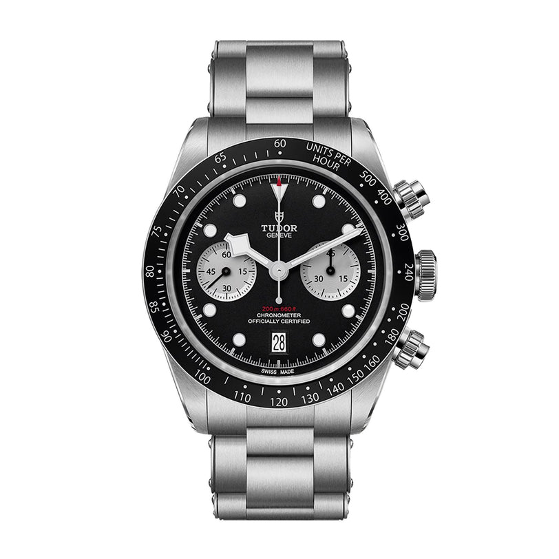 The TUDOR Black Bay Chrono is a stainless steel chronograph watch featuring a black dial with silver subdials, shown on a metal bracelet.