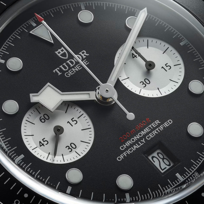 Close-up of the TUDOR Black Bay Chrono watch face featuring subdials, hands, and a date window at 6 o’clock.