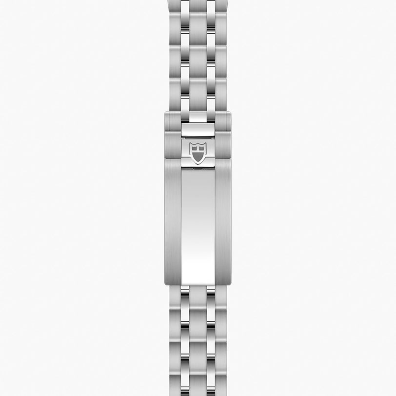 Stainless steel watch bracelet with linked segments and shield logo clasp.