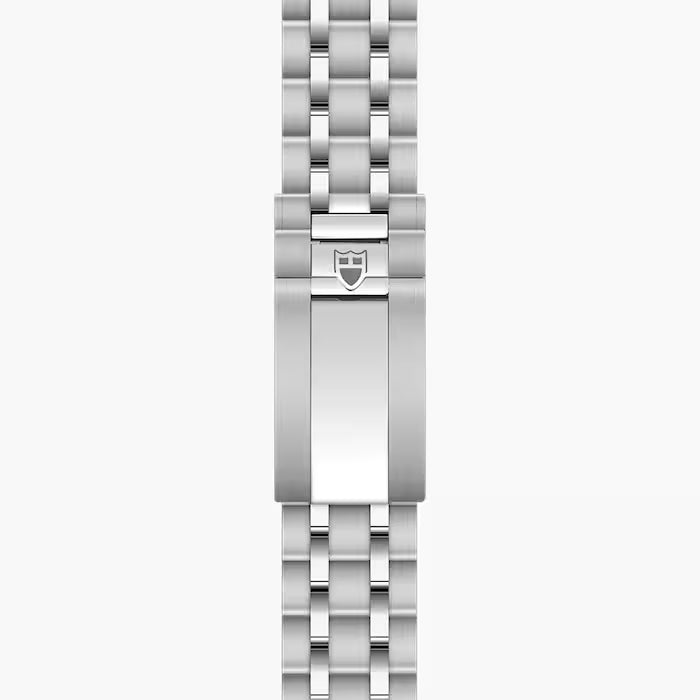 Stainless steel watch bracelet with linked segments and shield clasp logo.