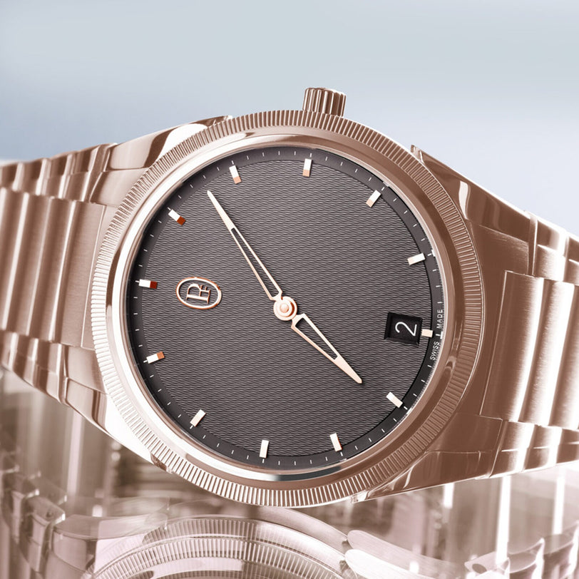 The Parmigiani Fleurier TONDA PF Micro-Rotor, a rose gold wristwatch featuring a textured gray dial and date display, is showcased on a reflective surface.