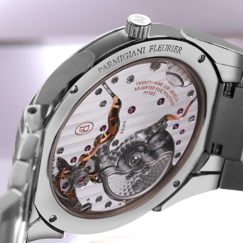Close-up of the back of a Parmigiani Fleurier TONDA PF Micro-Rotor watch highlighting its intricate mechanical movement and fine engravings.