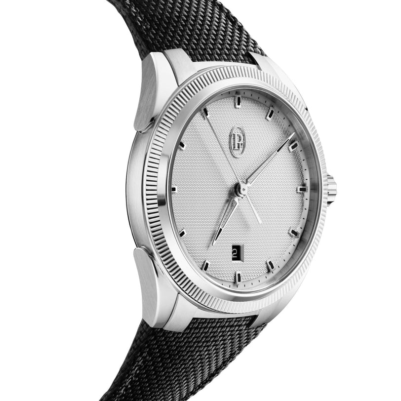 Photographed at an angle, the Parmigiani Fleurier G SS AU TONDA PF SPORT WHITE 24 showcases sporty elegance with its silver case, textured white dial, black mesh strap, fluted bezel, and date window at 6 oclock.
