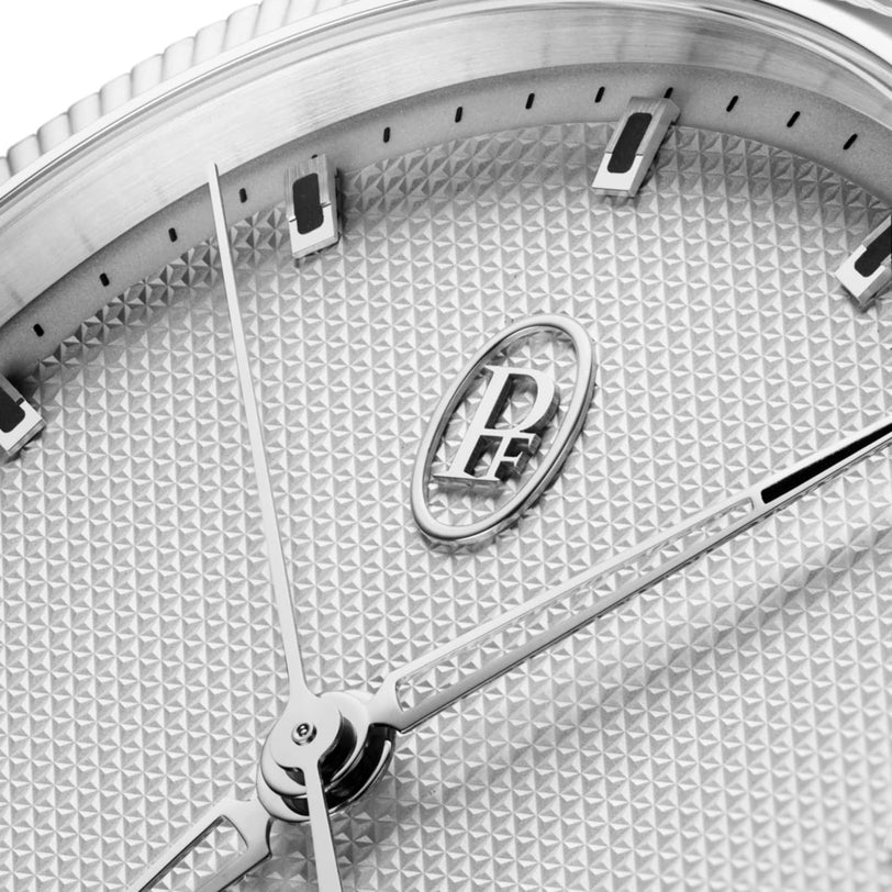 Close-up of the Parmigiani Fleurier TONDA PF Sport watch face, featuring a textured silver dial and the PF logo at the center.