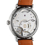 Close-up of the IWC Schaffhausen Portofino Hand-Wound Eight Days, revealing its intricate exposed gears, detailed engravings, and a brown leather strap.