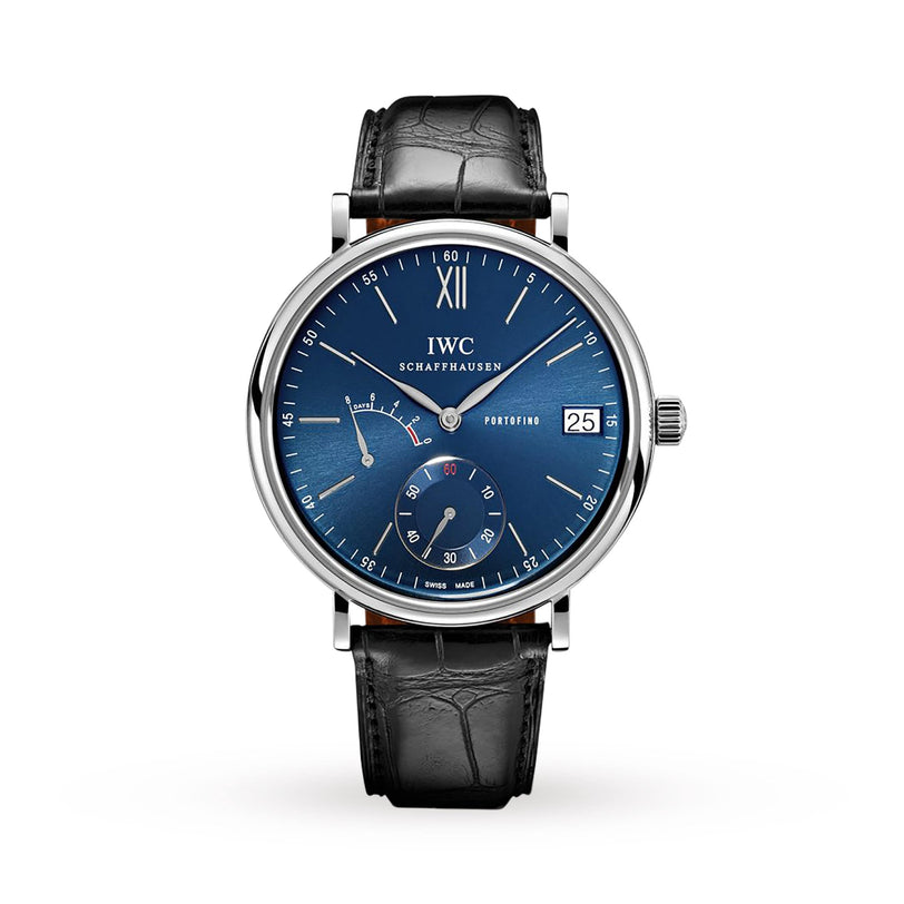The IWC Schaffhausen Portofino Hand-Wound Eight Days features a blue dial, silver case, black leather strap, date at 3 o’clock, power reserve and seconds subdials, and runs on the hand-wound 59210 caliber with an eight-day power reserve.