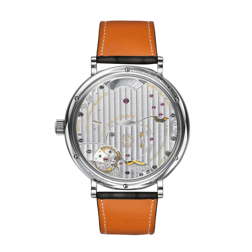 The IWC Schaffhausen Portofino Hand-Wound Eight Days features a brown leather strap and an exposed silver 59210 caliber movement with visible gears and jewels—a signature of Portofino craftsmanship.