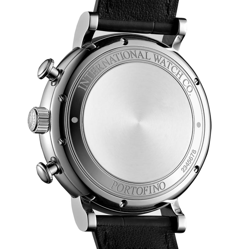Close-up of the back of an IWC Schaffhausen Portofino Chronograph with a stainless steel case engraved with International Watch Co. Portofino and serial number, paired with a black leather strap.