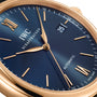 Close-up of the IWC Schaffhausen Portofino Automatic wristwatch featuring a blue dial, gold hands and markers, date display at 3 o’clock, and Automatic near 6—highlighting Swiss precision and self-winding movement.
