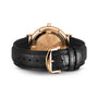 An IWC Schaffhausen Portofino Automatic wristwatch with a gold case and black leather strap is shown with the case back visible, revealing its engraved details and Swiss precision automatic movement.