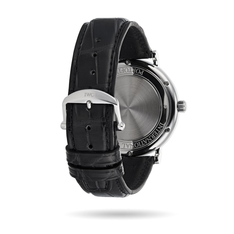 The IWC Schaffhausen Portofino Automatic features a black leather strap, stainless steel case, and closed caseback with buckle—showcasing Swiss precision craftsmanship.