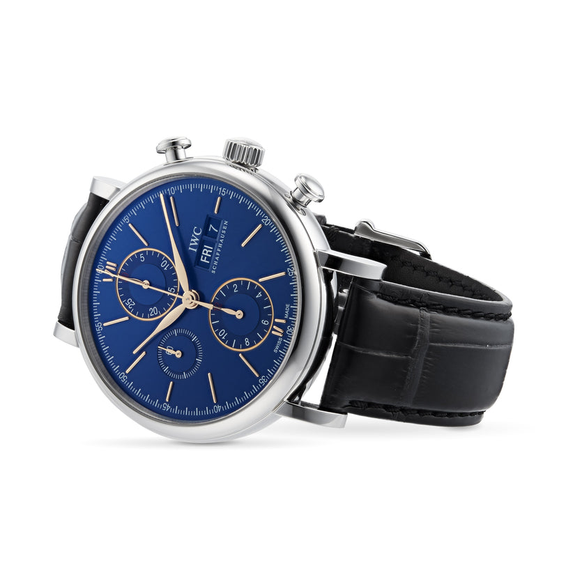 The IWC Schaffhausen Portofino Chronograph features a stainless steel case, blue dial with chronograph, three subdials, day and date display, and a black leather strap.