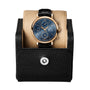 The IWC Schaffhausen Portofino Chronograph, featuring a gold case, blue dial, and black leather strap with chronograph functions, is displayed in a black leather watch case with a snap closure.