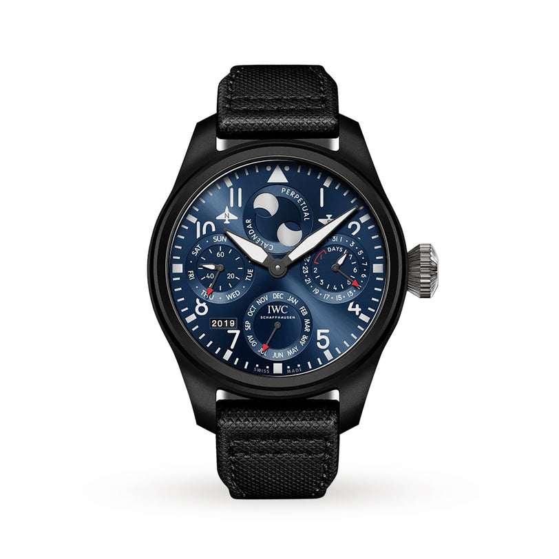 The IWC Schaffhausen Big Pilots Watch Perpetual Calendar Edition Rodeo Drive features a blue dial with multiple subdials, moonphase display, and fabric strap, set in a black ceramic and titanium case against a white background.