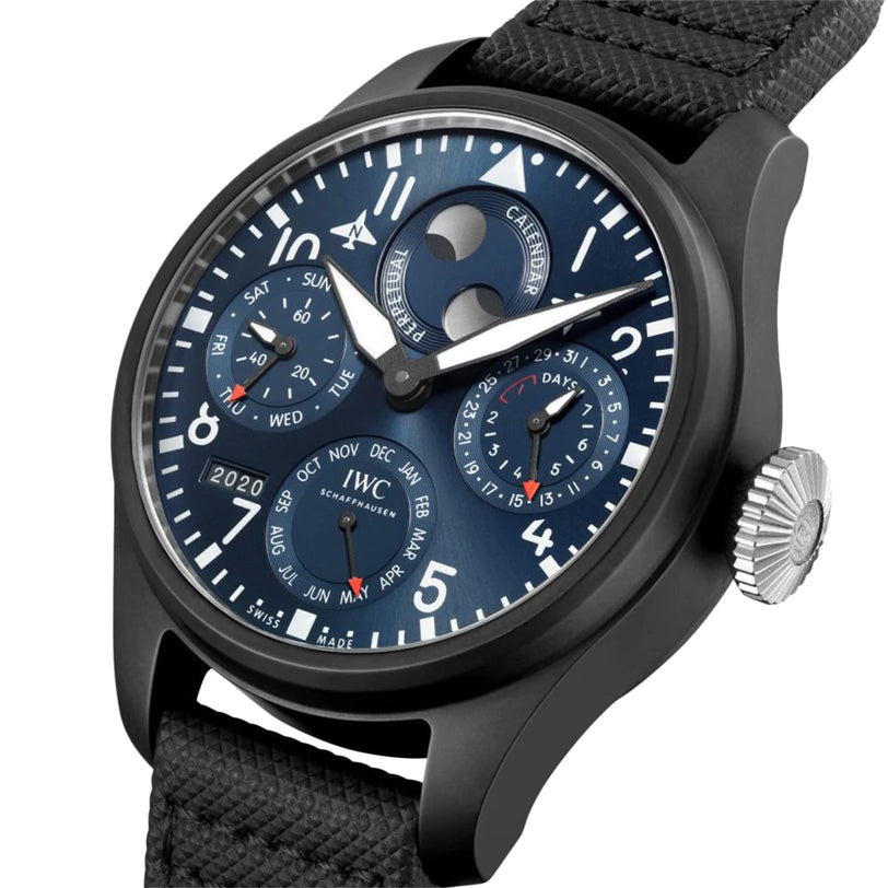 The IWC Schaffhausen Big Pilots Watch Perpetual Calendar Edition Rodeo Drive features a black ceramic and titanium case, blue dial with white markers, perpetual calendar displays, moon phase, and a textured black strap.