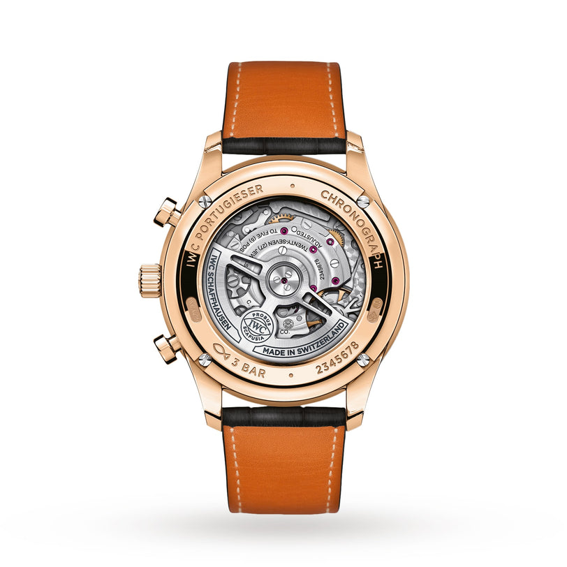 Back view of the IWC Schaffhausen Portugieser Chronograph displays its mechanical movement through a transparent case, highlighting precision timekeeping and paired with a brown leather strap.