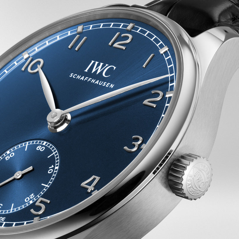 Close-up of the IWC Schaffhausen Portugieser Automatic 40 wristwatch featuring a blue dial, silver hands and numerals, crown on a stainless steel case, powered by an IWC-manufactured movement.