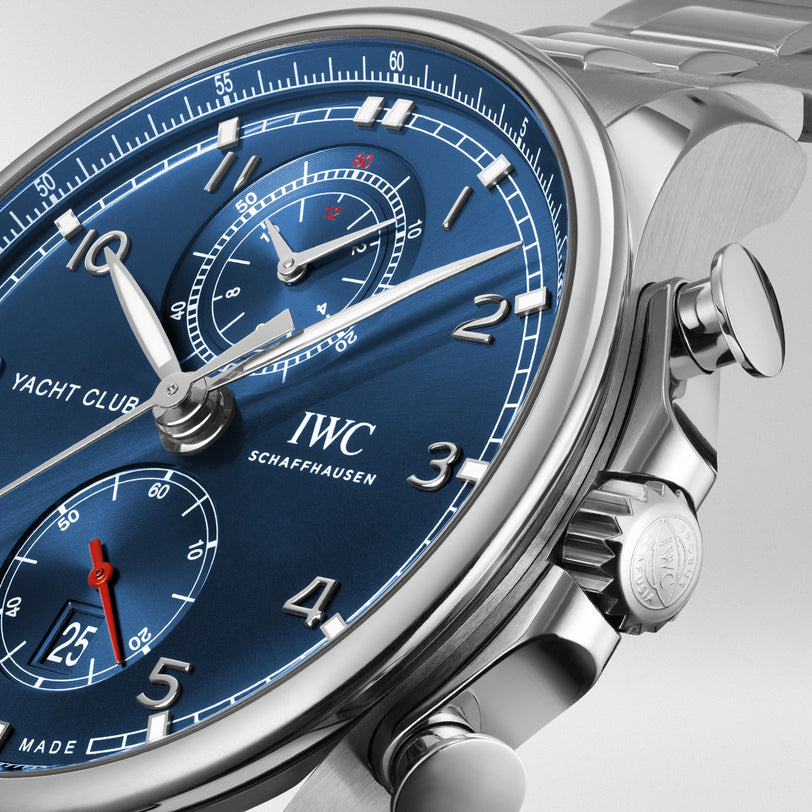 Close-up of the IWC Schaffhausen Portugieser Yacht Club Chronograph, featuring a blue dial, silver markers, date display, chronograph subdials, and the IWC 89361 calibre in a stainless steel case.