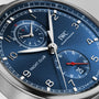 Close-up of the IWC Schaffhausen Portugieser Yacht Club Chronograph’s blue dial with silver hands, hour markers, subdials, red accents, and the IWC-manufactured 89361 calibre—a true nautical sports watch.