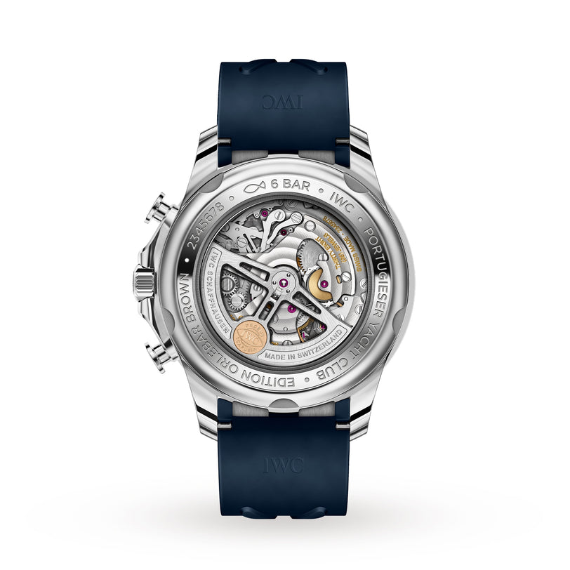 Back view of the IWC Schaffhausen Portugieser Yacht Club Chronograph Edition Orlebar Brown shows automatic movement, exposed mechanics, engraved caseback, and a dark blue rubber strap inspired by nautical sports watches.