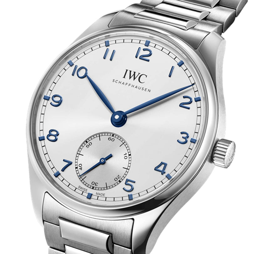The IWC Schaffhausen Portugieser Automatic 40 features a silver case, white dial with blue hands and Arabic numerals, small seconds at 6 o’clock, high precision timekeeping, and a stainless steel bracelet.