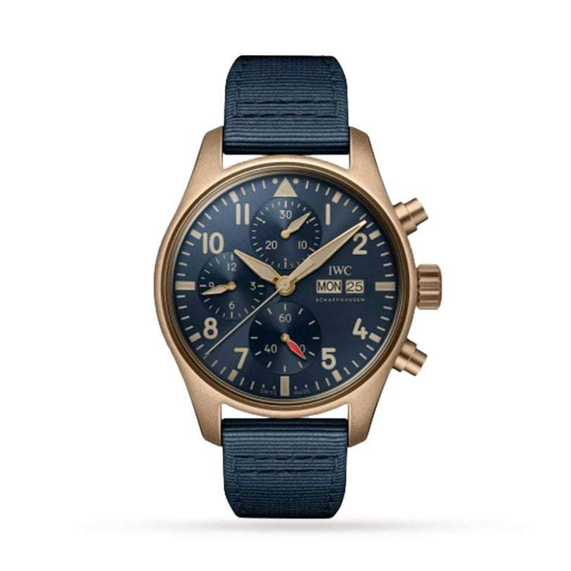The IWC Schaffhausen Pilots Watch Chronograph 41 features a gold-tone chronograph, blue dial with three subdials, day and date display, and a blue fabric strap, shown against a white background.
