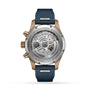 Back view of the IWC Schaffhausen Pilots Watch Chronograph 41 shows a visible mechanical movement, bronze case, blue strap, and engraved markings around the caseback.
