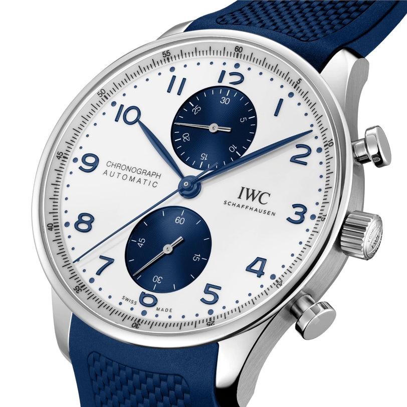 A close-up of the IWC Schaffhausen Portugieser Chronograph featuring a stainless steel case, blue strap, white dial, and coordinating blue subdials and numerals.